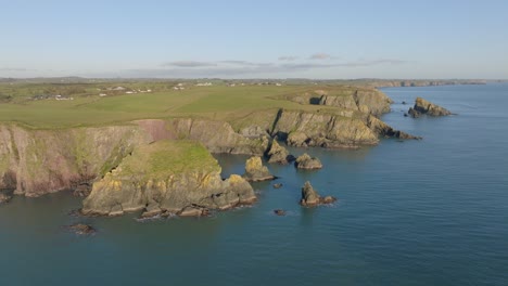 Drone-seascape-sea-stacks-hidden-coves-and-cliffs-Copper-Coast-Waterford-Ireland