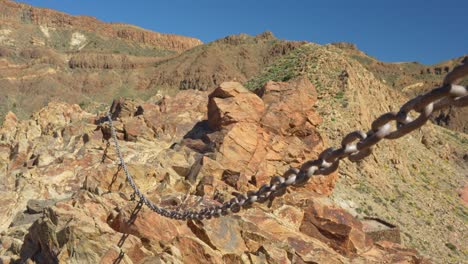 Chains-for-hiking-trail-through-rocky-terrain-of-Tenerife