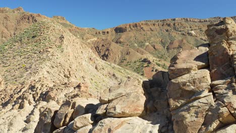 Rock-formation-and-mountains-of-Tenerife-island,-pan-left-view