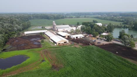 Iconic-American-farmstead-for-dairy-production-in-Michigan,-aerial-drone-view