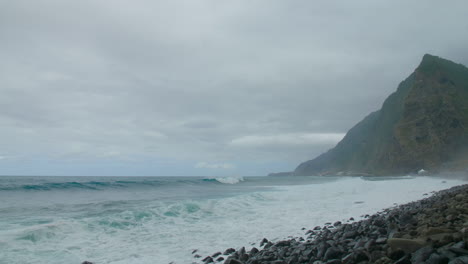 Waves-on-coast-of-Madeira-beach-ocean-cloudy-sky-Porto-Moniz-Seixal-rocks-Vacation-travel