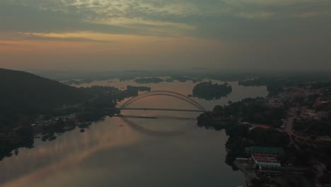 Aerial-shot-approaching-to-view-the-Adomi-bridge-in-the-horizon-at-Akosombo-Atimpoku,-Eatern-Region