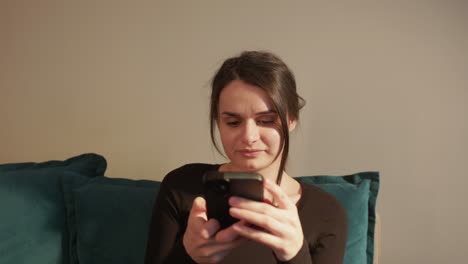 Girl-Browsing-Internet-On-Mobile-Phone---Close-Up-Shot