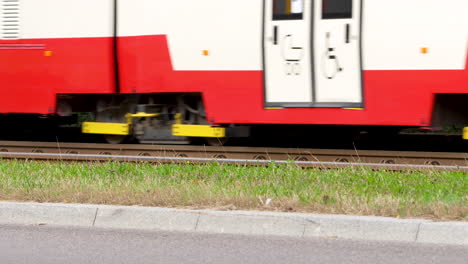 Blurred-red-train-carriages-speeding-on-tracks