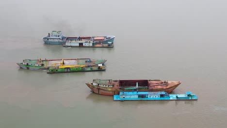 Rusted-cargo-ships-being-filled-by-sand-dredgers-in-the-Indian-ocean-bay-of-Bengal