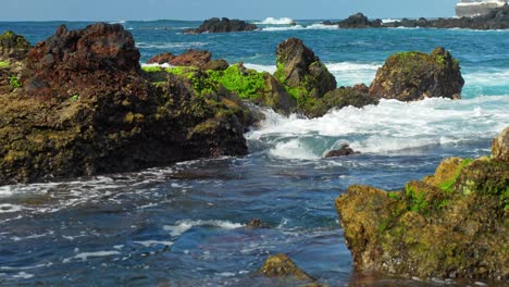 Atlantic-ocean-waves-flowing-over-rocky-coast-of-Tenerife,-handheld