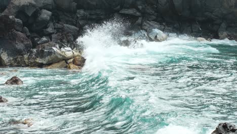 Powerful-waves-splashing-over-rocky-coastline-of-Tenerife,-slow-motion
