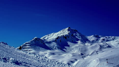 The-snow-covered-mountains-of-the-Austrian-Alps-against-a-bright-blue-sky