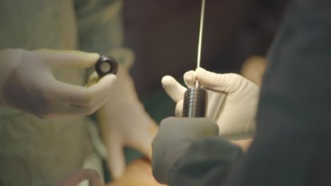 Plastic-surgeon-manipulating-a-suction-catheter