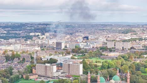 Fumes-are-rising-above-the-densely-built-up-districts-of-Bradford,-UK