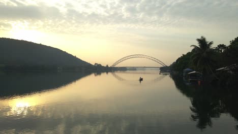 Aerail-shot-moving-sidesways-to-view-the-Adomi-bridge-and-the-Volta-Lake-in-the-horison