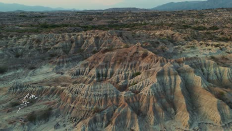 Incredible-Red-Organge-Erosion-in-Tatacoa-Desert-Landscape,-Aerial