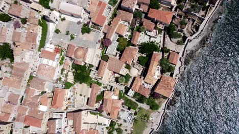 Overhead-drone-view-of-the-old-town-of-Monemvasia-on-a-tied-island-off-the-east-coast-of-the-Peloponnese,-Greece