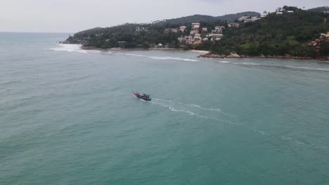 Aerial-View-Of-Longboat-Sailing-Off-Coast-Of-Koh-Phangan