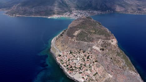 Drone-shot-of-Monemvasia-town-off-the-east-coast-of-Peloponnese-surrounded-by-sea,-Greece