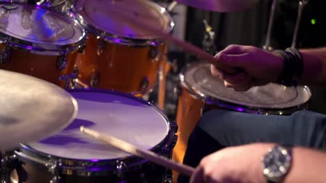 drummer-enthusiastically-rhythmically-hits-the-drum-kit