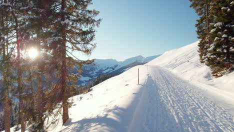 Snow-Covered-Trails-Near-Saalbach-Hinterglemm-With-Reiterkogel-And-HasenauerKöpfl-Mountains-In-The-Background-In-Austria