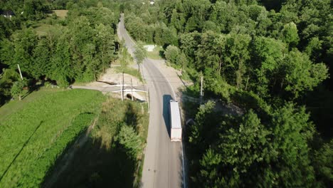 4k-Aerial-View-of-Semi-Truck-Driving-Through-Countryside-Landscape