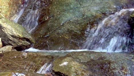 Natural-stream-finds-its-way-over-a-rocky-surface
