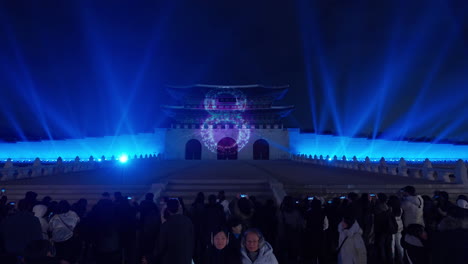 2024-New-Year-Count-Down-Projected-on-Gwanghwamun-Gate-in-Seoul-at-Night,-Crowd-People-Enjoy-Lights-Show-at-Gwanhwamun-Square-on-New-Year's-Eve