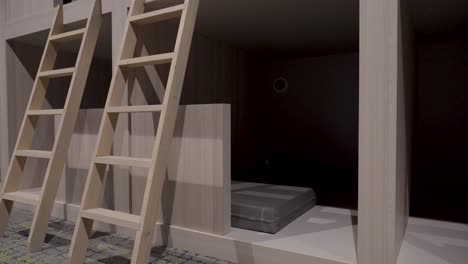 Slow-pull-out-shot-of-wooden-ladders-at-the-side-of-a-bunk-bed