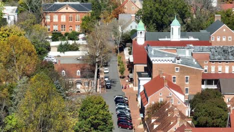 Old-Salem-with-aerial-reveal-of-modern-Winston-Salem-skyline-in-North-Carolina-during-autumn