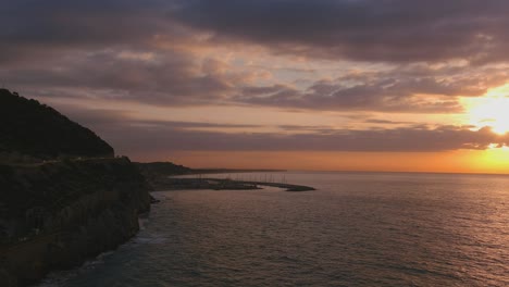 Dramatic-view-of-road-and-Ginesta-port-in-Costa-del-Garraf-at-sunrise