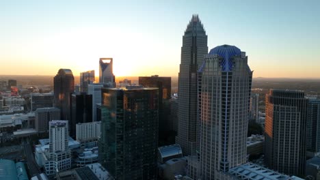Downtown-Charlotte,-North-Carolina-skyline-during-golden-hour-sunset-with-starburst-effect