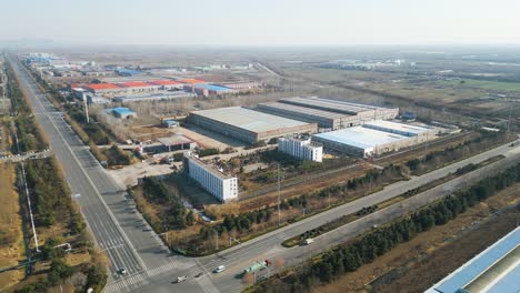An-aerial-perspective-captures-a-factory-situated-on-the-industrial-outskirts-of-Shandong-Province,-Linyi,-China