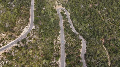 Top-shot-of-driving-car-on-the-road-in-the-Esporles-valley-on-the-island-village-of-Mallorca-in-the-Serra-de-Tramuntana,-Spain