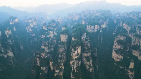 Aerial-view-captures-Zhangjiajie-National-Park-in-Wulingyuan,-Hunan,-China,-featuring-the-renowned-Karst-Mountains,-famously-known-as-the-Avatar-Hallelujah-Mountains