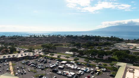 Busy-township-of-Lahaina-on-sunny-tropical-day,-aerial-view