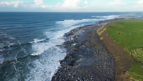 Rough-sea-waves-breaking-against-rocky-Irish-coast,-Doolin-in-Ireland