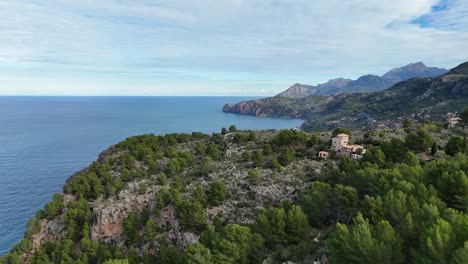 Aerial-flyover-coastline-of-Mallorca-with-villa-and-Mirador-de-sa-Foradada-Viewpoint-during-summer-day