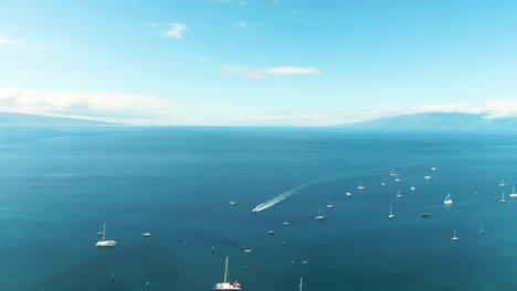 Moored-yachts-and-township-of-Lahaina,-aerial-drone-view