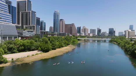 Aerial-view-circling-kayaks-on-the-Lady-Bird-Lake-in-sunny-day-in-Austin,-USA
