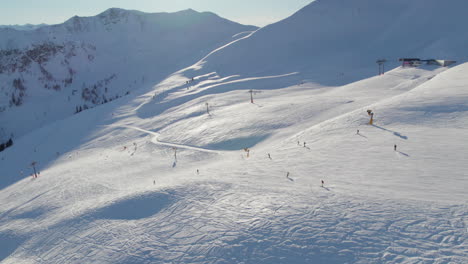 Skiers-At-Ski-Resort-In-Saalbach-Hinterglemm,-Austria---Drone-Shot