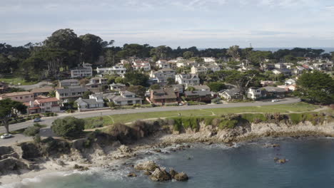 4K-cinematic-flight-over-ocean-front-houses-in-Pacific-Grove-California