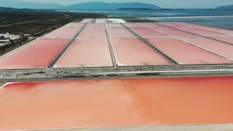 Impressive-aerial-view-of-colorful-sea-salt-farm-evaporation-ponds-in-Albania