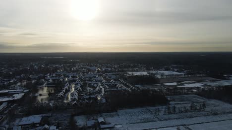 Beautiful-aerial-overview-of-a-snow-covered-town-at-sunset