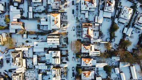 Top-down-aerial-of-a-wealthy-suburban-neighborhood-on-a-sunny-winter-day
