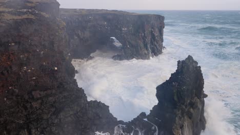 Rough-wild-sea-clashing-on-the-high-cliffs-on-Iceland-on-a-stormy-day