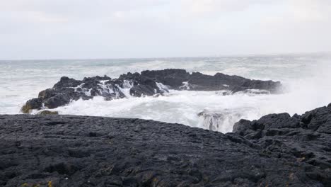 High-waves-clashing-on-black-basalt-rocks-on-the-coast-of-Iceland