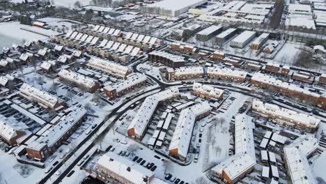 Amazing-aerial-overview-of-Suburban-neighborhood-covered-in-snow-on-a-sunny-day