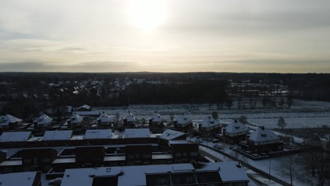 Jib-up-of-a-beautiful-snow-covered-suburban-neighborhood-at-sunset