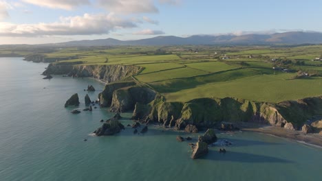 drone-landscape-sea-stacks-beaches-cliffs-farmland-and-mountains-Copper-Coast-Waterford-Ireland