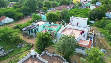 Lush,-rural-village-near-Karaikudi-with-traditional-houses-and-greenery,-aerial-view