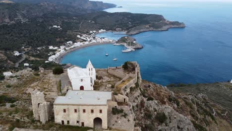 Orbital-Cinematic-View-over-Castle-of-Chora-Kythira-and-Kapsali-Bay,-Greece