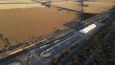 Aerial-top-down-shot-showing-industrial-distribution-station-on-wheat-field-in-Western-Australia