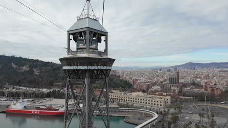 Aerial-view-of-Barcelona-city,-Spain,-hyperlapse-from-inside-a-classic-cable-car